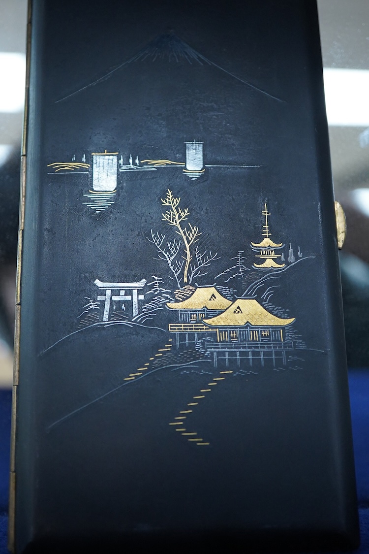 A Japanese photograph album, late 1940's to include banknotes and a telegram, together with a cigarette case